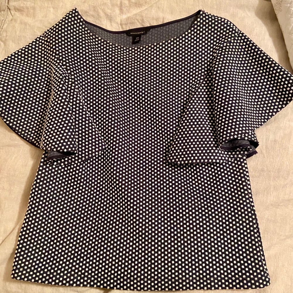 Blue and white polka dot shirt